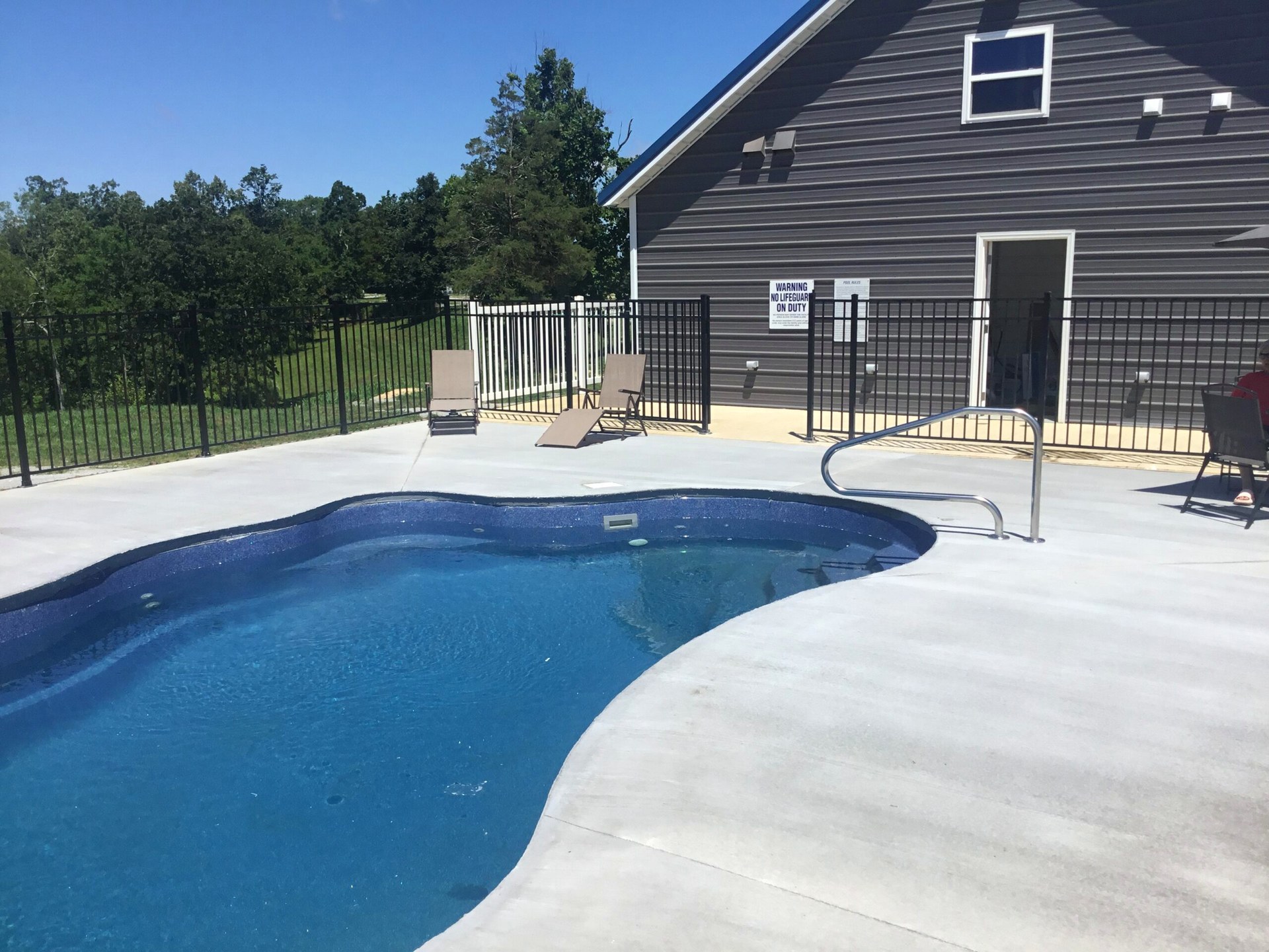 Pool with handicap rail and lounge seating